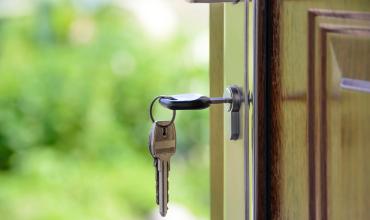 Veterans with Military-related Disabilities Face Significant Housing Barriers Key in a door with greenery background