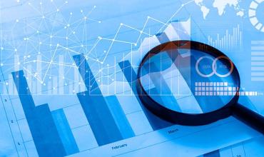 Rent Burden Linked to Postponing Medical Care Blue graphs with a microscope