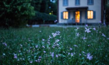 Homes Reach Decade High Unaffordability Levels A house with flowers out front
