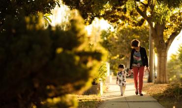 15- or 30- Year Mortgages: Which One is Right for You? a woman and a child walking on a sidewalk