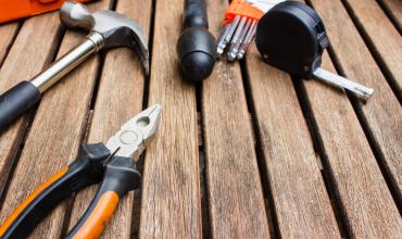 NC Housing Finance Agency Awards $11 Million for Home Rehab in 30 Counties Tools laying on a wood deck