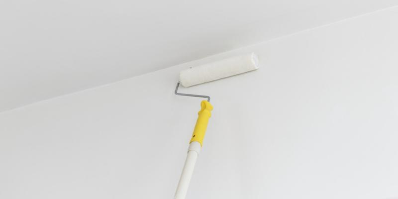 3 Unexpected Things That Decrease Your Home Value a person painting a ceiling