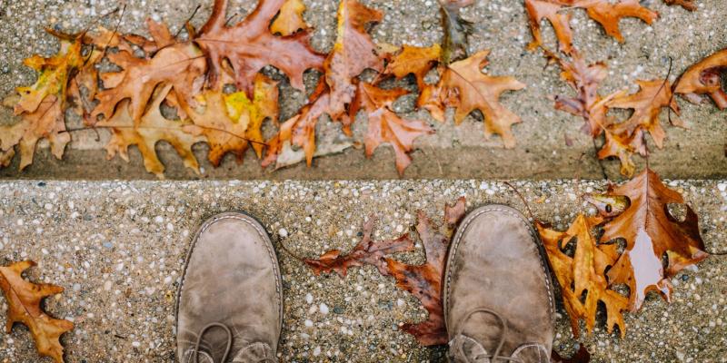 Why You Should House Hunt in Person Shoes on stairs with leaves