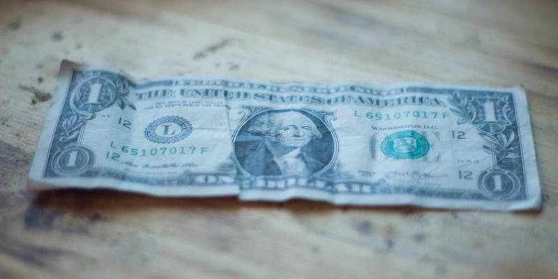 How to Calculate Your Home Purchase Budget a dollar bill on a wooden table