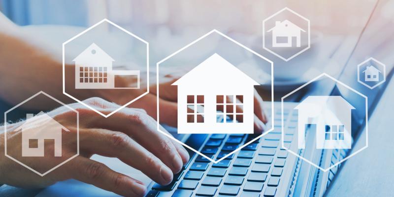 Pandemic Continues to Wreak Havoc on Housing Affordability House icons over someone typing on a computer