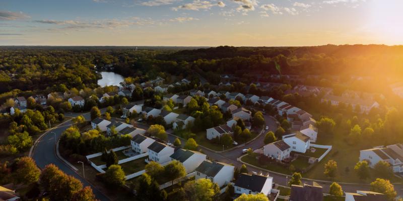 The Black-White Home Ownership Gap in North Carolina Aerial view of a suburban neighborhood at dusk