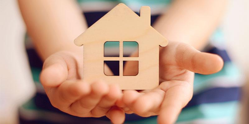 Buying a Home? Know Your Rights at Closing Hands holding home