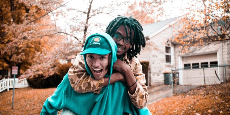 4 Signs You’re Ready to Buy a Home Two people piggybacking on a street