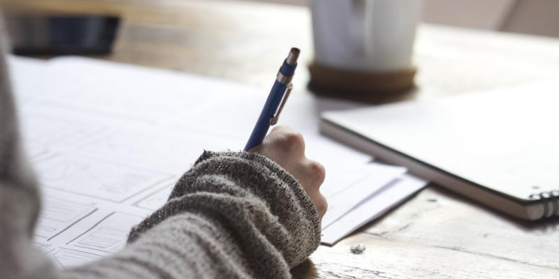 New Report Shows Affordability Gap Still Significant for Renters a person writing notes