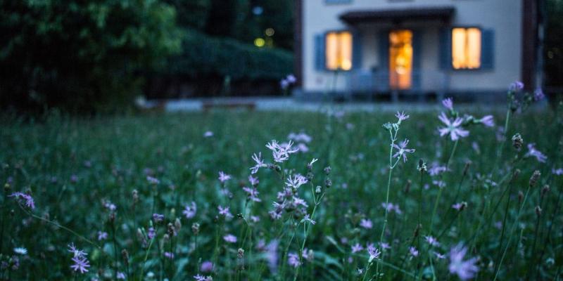 Homes Reach Decade High Unaffordability Levels A house with flowers out front