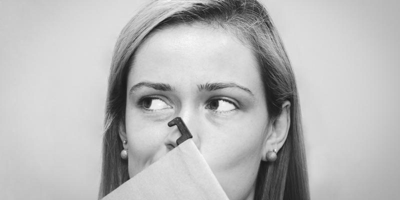 What Are Biweekly Payments, and Are They Worth It? a woman holding a folder in front of her face