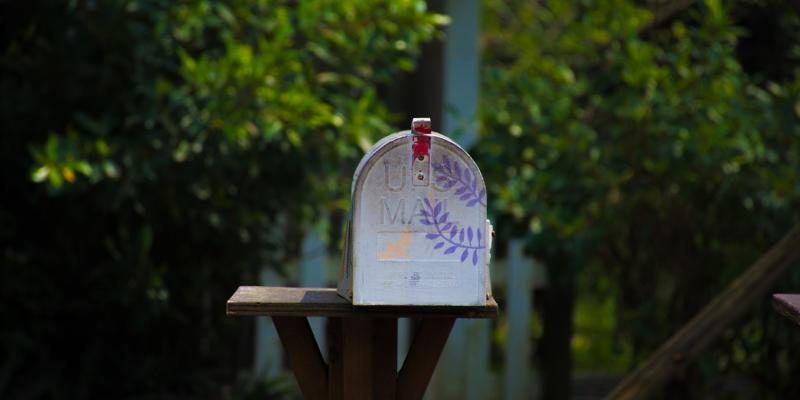 Housing Identified as a Primary Health Impact a mailbox with greenery around it