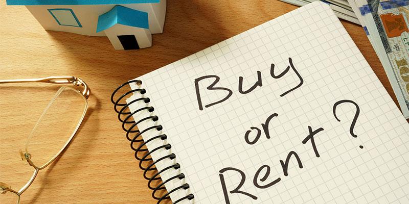 Top 5 Hidden Expenses of Home Ownership a notebook with the words Buy or Rent scrawled on it