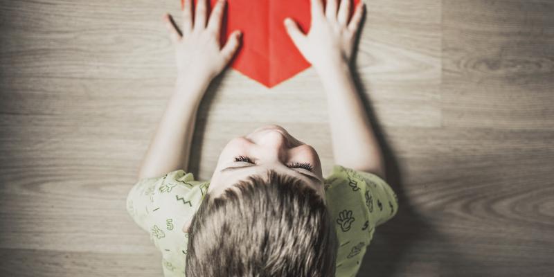How to Build a Home Disaster Emergency Kit child holding a red paper heart