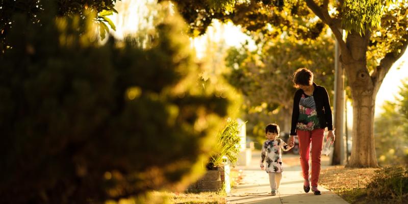 15- or 30- Year Mortgages: Which One is Right for You? a woman and a child walking on a sidewalk