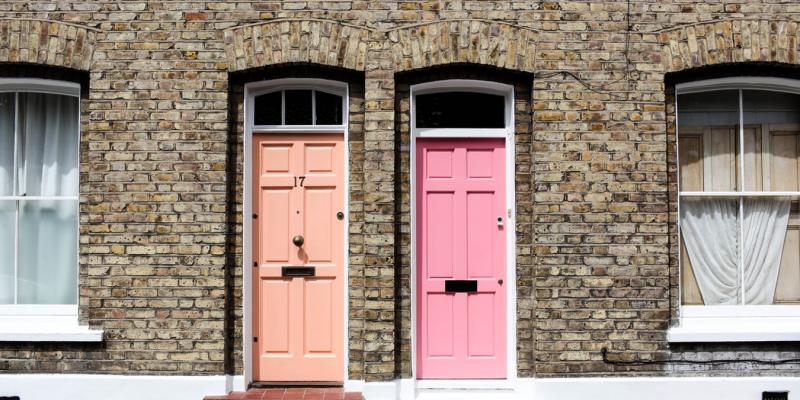 Is a Townhome or a Condo Right for You? a coral door and a pink door side by side
