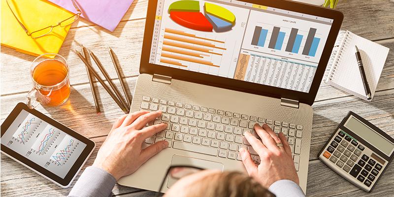 Fannie Mae and Freddie Mac Affirm Their “Duty to Serve” Low-Income Home Seekers A desk with a computer, tablet and person working