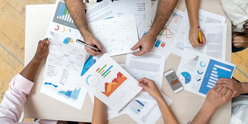 US, Japan Housing Agencies Partner on Aging in Place Research People's hands on a desk working on paperwork
