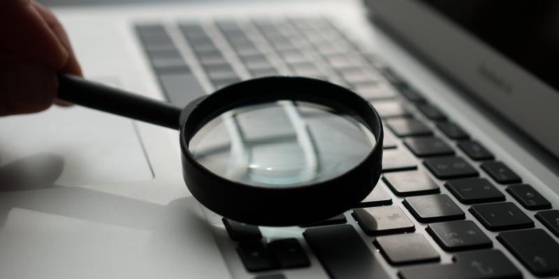 The Emerging Impact of COVID-19 on Renter Households Computer with a magnifying glass on it
