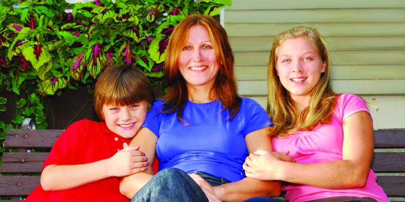 Top 3 Financial Reasons to Buy Instead of Rent in 2017 a smiling mother with her children, sitting on a bench