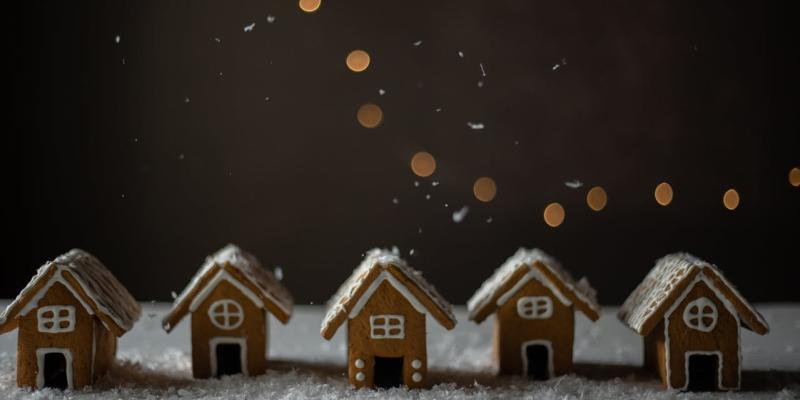 New Year, New Home? Make 2025 Your Year of Home Ownership Tiny gingerbread houses in a row
